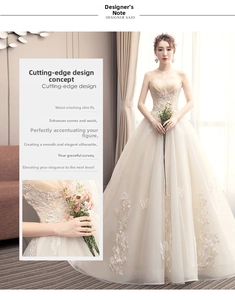 Detail of champagne strapless wedding dress with 3D floral lace embroidery and beads