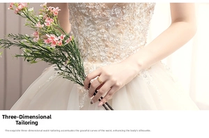 Detail of ivory lace wedding dress with manual beading and 3D tailoring texture