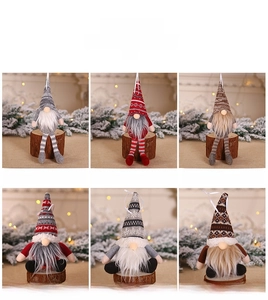 Detailed view of handmade Christmas forest gnomes in various festive colors and styles