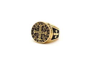 Detailed close-up of gold and black Saint Benedict medal ring in stainless steel