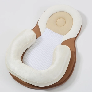 Ergonomic infant positioning pillow with breathable white mesh for flat head prevention