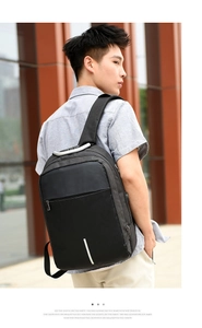 Detail of laptop backpack with safety reflective strip and USB charging port on the side