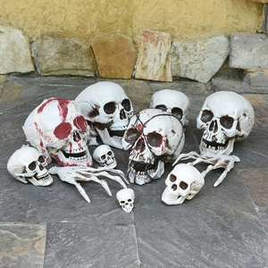 Halloween scary skull and hand bone decorations with blood stains and gauze for spooky props