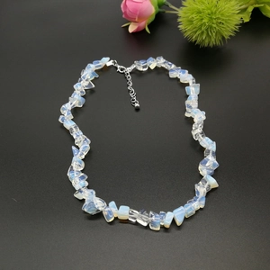 Macro shot of irregular natural white crystal shards on a necklace with silver clasp
