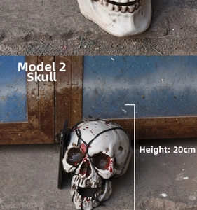 Realistic Halloween skull prop with blood splatters and wire detail, 20cm height