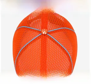 Breathable orange mesh fabric detail with sky blue accents and checkered top button