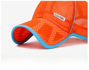 Macro view of breathable orange mesh fabric and blue trim on the sport sun hat