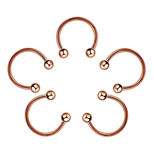 Macro view of five rose gold C-shaped nose rings with metallic beads in a flower layout