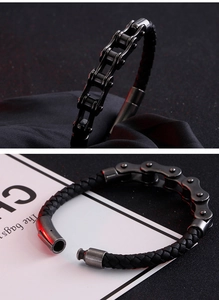 Detailed close-up of a punk style black bicycle chain and braided leather bracelet