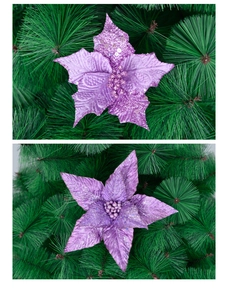 Detail of purple glitter poinsettia flower attached to Christmas tree branches