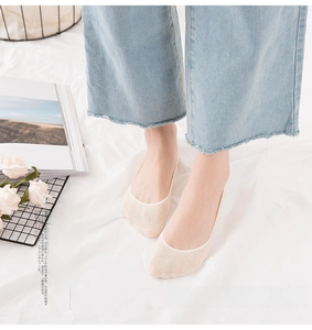 Detail of skin-tone seamless no-show cotton socks with breathable mesh fabric
