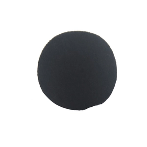 Round black felt pad for service dog harness or furniture protection on white background