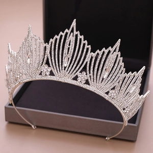 Detail of silver bridal crown with sparkling clear crystals and flower motifs in jewelry box