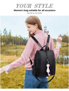 Women's black nylon backpack with anti-theft zipper and cute cat pendant charm