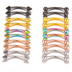 Macro view of assorted curved barbells in multiple colors with cone and ball ends