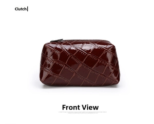 Detail shot of deep brown crocodile texture and glossy patent leather on small bag