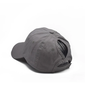 Detail view of cotton ponytail baseball cap featuring cross-opening and adjustable strap