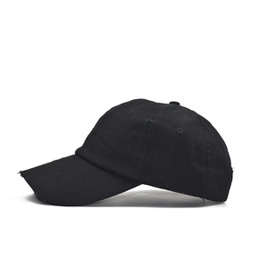 Distressed black cotton baseball cap with ripped details and curved brim for women