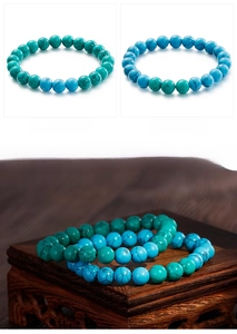 Detailed macro view of vintage turquoise bead bracelets in teal and sky blue tones