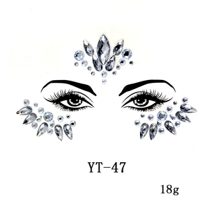 Detailed view of rhinestone face jewels with teardrop and round shapes for festival makeup