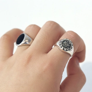 Detail of vintage 925 sterling silver rings with Eye of Horus and black onyx inlay