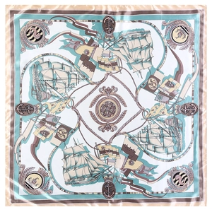Detail of the nautical theme silk scarf featuring hand-painted sailboats and blue borders