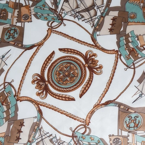 Detailed pattern of nautical scarf featuring compass, anchor and vintage sailing motifs