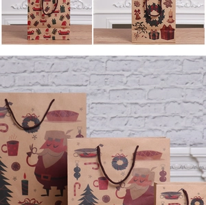 Macro view of Christmas kraft paper gift bags with Santa and festive patterns on a table