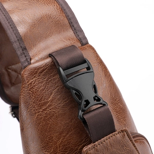 Brown leather sling bag with lychee texture and high-quality black plastic buckle detail