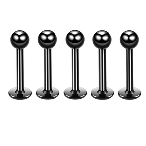 Detailed view of five black stainless steel labret studs with ball tops on a white background