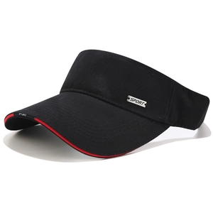 Detail of sport metal badge and red contrast piping on black cotton sun visor hat