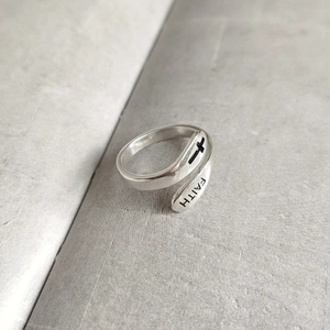 Detail of 925 sterling silver Faith cross ring showing engraved text and cross icon