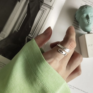 Detailed macro view of 925 silver cross ring with FAITH engraving and wrap design