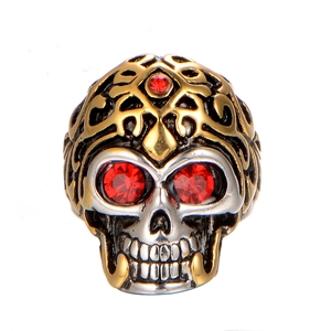 Vintage punk skull ring in gold and silver steel with red zircon eyes and floral carving