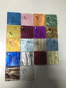 Selection of colorful marbled acrylic sample plates for luxury evening clutch bags