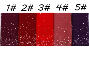 Detail of five solid color chiffon scarves with white pearl accents and rhinestone studs