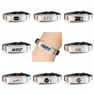 Collage of black silicone wristbands with stainless steel plates featuring K-pop group logos