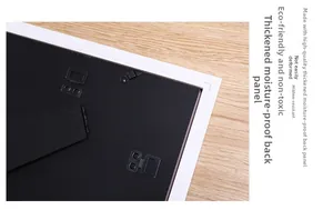 Detail of the moisture-proof backboard and sturdy metal clips on a white photo frame