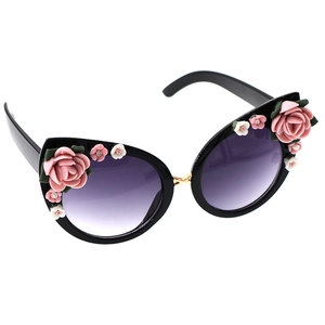Chic black cat eye sunglasses with 3D floral accents and gradient purple lenses