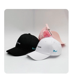 Detailed close-up of chenille bucket hats in black, white, and pink with embroidery