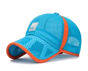 Detail of blue breathable mesh baseball cap with orange trim and sport fashion patch