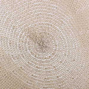 Detail of breathable straw mesh weave on beige summer beret sun hat for middle-aged men