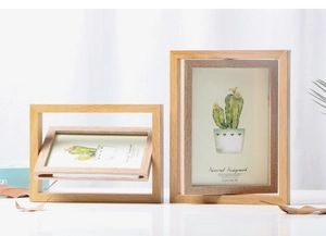 Close-up of rotating light wood photo frames in 10x15cm and 13x18cm sizes