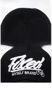 Detailed view of high-density 3D embroidery on a black cotton baseball cap with bike icon