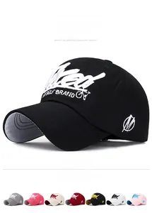 Detail view of cotton baseball cap with white 3D embroidery and multiple color options