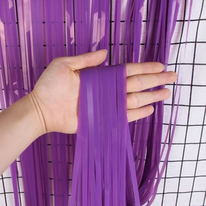Detailed close-up showing texture of purple macaron fringe tinsel curtain for party decor