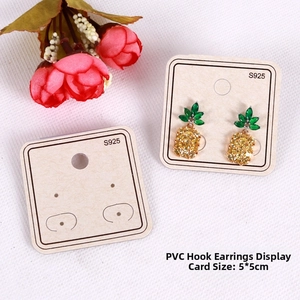 Close-up of 5x5cm square PVC earring display cards with S925 print and pineapple studs