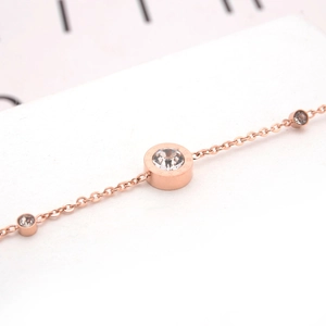 Rose gold titanium steel bracelet featuring three round clear zircon stones on a fine chain
