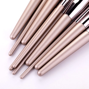 Champagne gold 10-piece makeup brush set with matte handles and rose gold ferrule detail