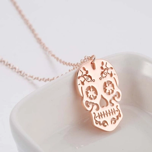 Rose gold hollow skull pendant necklace in minimalist stainless steel for women